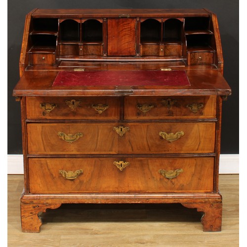 355 - A George II feather-banded walnut bureau, crossbanded fall front enclosing a well with secret compar... 