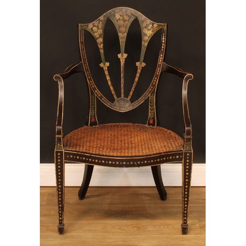 430 - A Hepplewhite Revival painted and ebonised open armchair, cane seat, tapered square forelegs, spade ... 