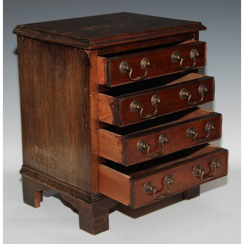 523 - Miniature Furniture - a George III style table top chest, rectangular top above four long drawers, s... 