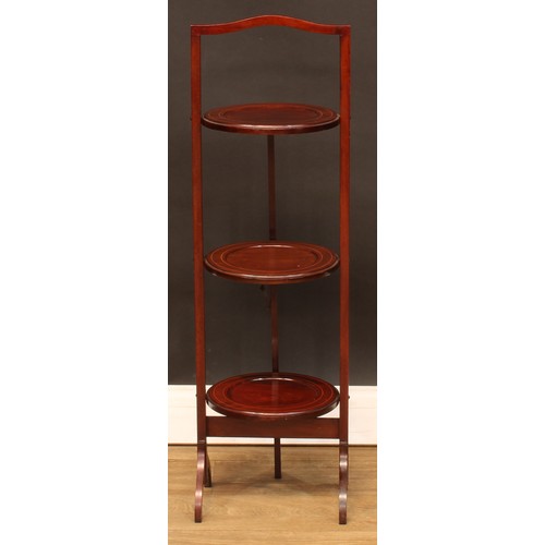 356 - A George II style bedside or lamp table; an Edwardian bedroom cabinet; another; a folding three-tier... 