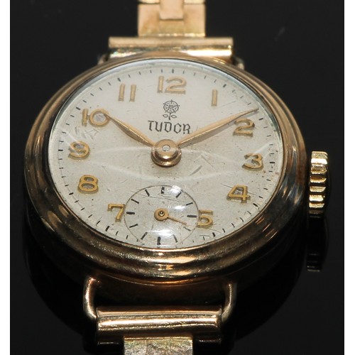 65 - A 9ct gold Tudor lady's wristwatch, 2.75cm champagne dial applied with Arabic numerals, subsidiary s... 