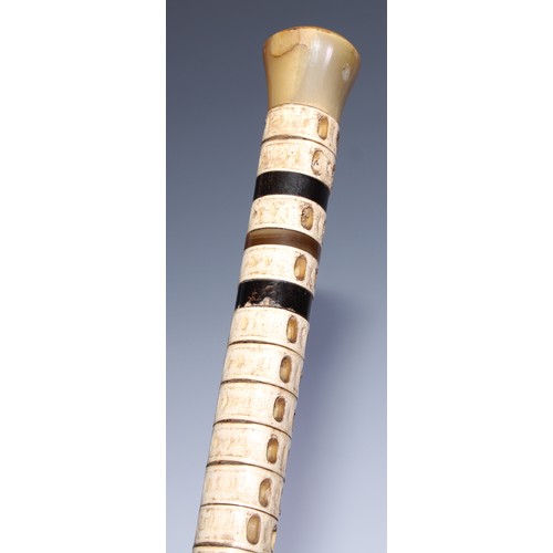 399 - Rabology - a late 19th century shark vertebrae walking cane, horn pommel and ferrule, 88.5cm long