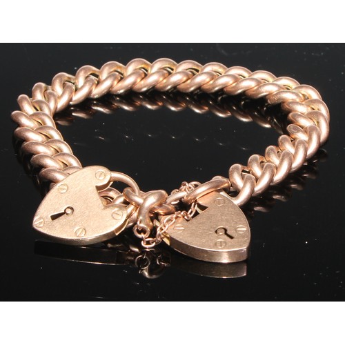 144 - A 9ct gold curb link, quite plain, padlock clasp; another with two padlock clasps, 43.2g (2)