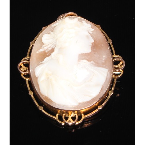 150 - A 9ct gold oval shell cameo brooch carved with Diana, pierced interlinked mount, 5.5cm high; a Victo... 