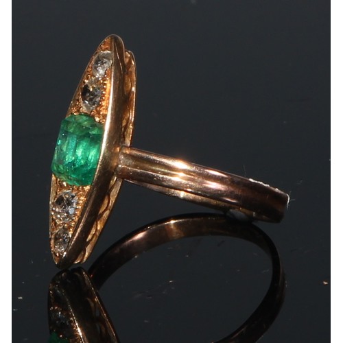 257 - An emerald and diamond elongated navette shaped ring, central square cushion cut emerald flanked by ... 