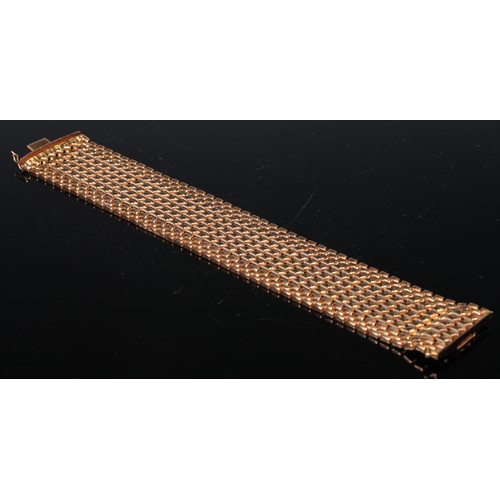 242 - An 18ct gold Brevet articulated bracelet, formed from interlocked zigzag bands, 19cm long, 53g