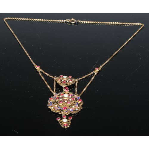 153 - A Baroque style pendant, set with semi precious stones and pearls on a scrolling openwork enamel gro... 