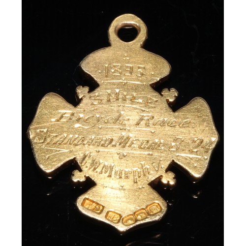 243 - An 18ct gold presentation fob for Dublin University Athletics Union, presented to C W Murphy for the... 