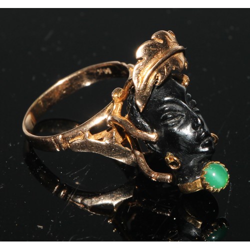 158 - A Corletto 14ct gold Blackamoor Ring, the carved head with articulated earrings and open wirework mo... 