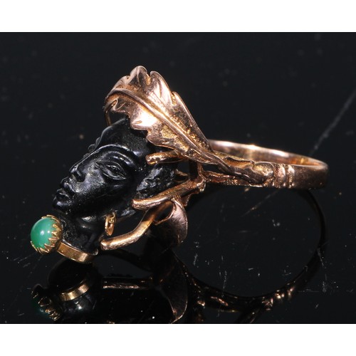 158 - A Corletto 14ct gold Blackamoor Ring, the carved head with articulated earrings and open wirework mo... 