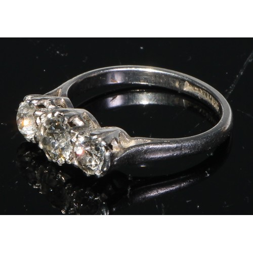 218 - A three stone diamond ring, brilliant cut stones, platinum shank, size K/L