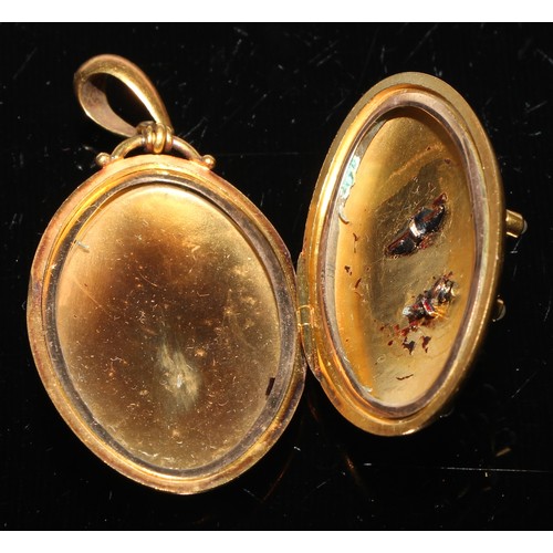 268 - A Victorian oval diamond set locket in Etruscan Revival style, centered with an eight pointed star a... 