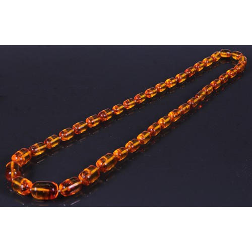 181 - A graduated deep orangy amber coloured resin faceted block bead necklace, beads ranging between appr... 