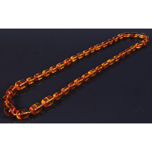 181 - A graduated deep orangy amber coloured resin faceted block bead necklace, beads ranging between appr... 