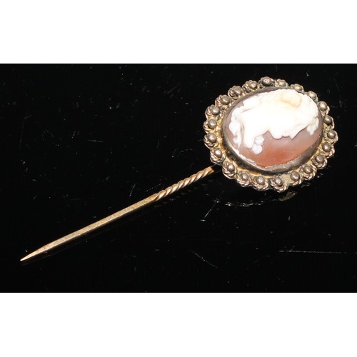 233 - A Victorian shell cameo stick pin, carved with a bearded and crowned portrait, yellow strap mopunt, ... 