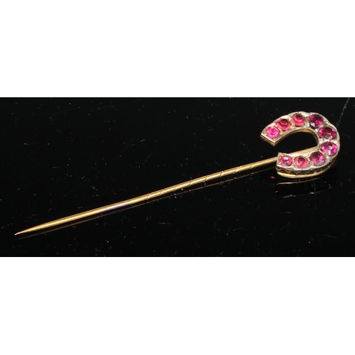 129 - A 19th century pinky red garnet inset horseshoe stickpin,  gilt metal mount;  others seed pearl,  re... 