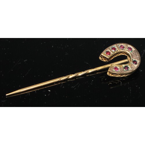 129 - A 19th century pinky red garnet inset horseshoe stickpin,  gilt metal mount;  others seed pearl,  re... 