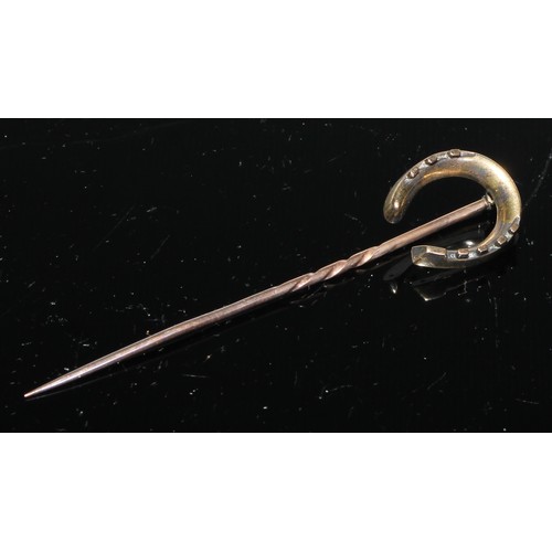 129 - A 19th century pinky red garnet inset horseshoe stickpin,  gilt metal mount;  others seed pearl,  re... 