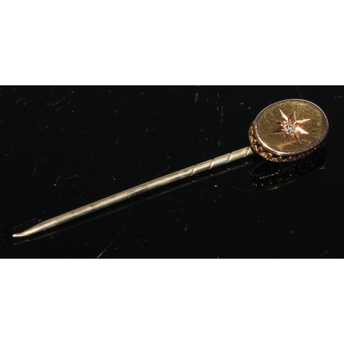 122 - A 19th century diamond and seed pearl yellow metal stick pin, as a flower, unmarked;  another navett... 