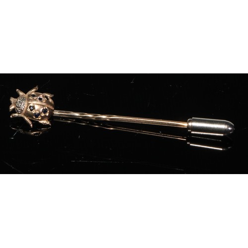 189 - A late 19th century diamond and sapphire yellow metal stick pin, as a ladybird, unmarked;  others, m... 