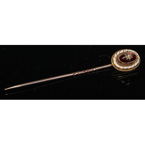 118 - A 19th century cabochon garnet seed pearl and enamel yellow metal stick pin, unmarked;  others seed ... 