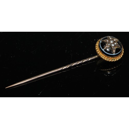 118 - A 19th century cabochon garnet seed pearl and enamel yellow metal stick pin, unmarked;  others seed ... 