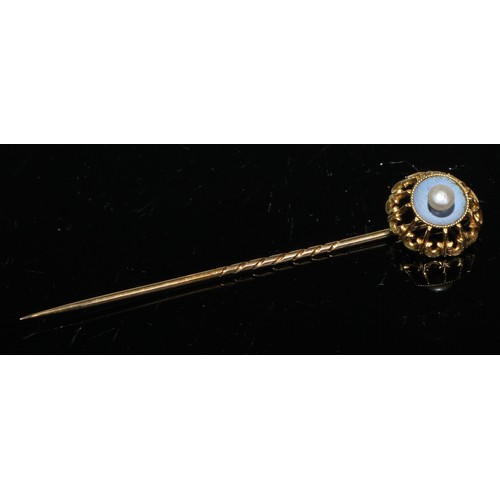 118 - A 19th century cabochon garnet seed pearl and enamel yellow metal stick pin, unmarked;  others seed ... 