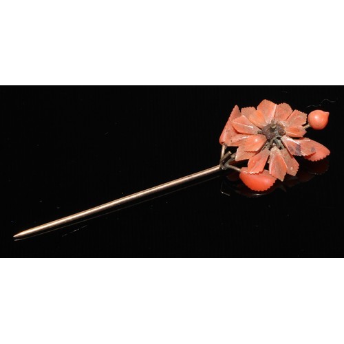 121 - A 19th century diamond and coral stick pin, central coral cabochon quartered by round old cut diamon... 