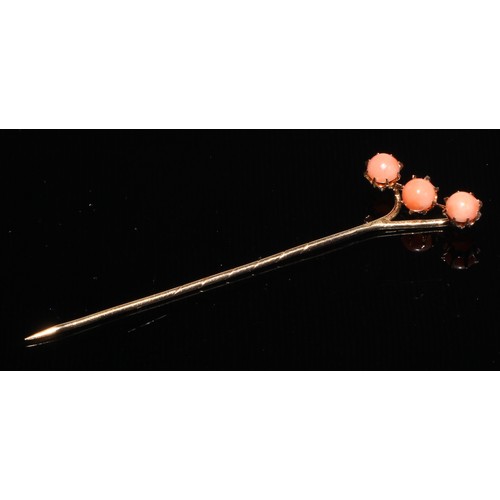 121 - A 19th century diamond and coral stick pin, central coral cabochon quartered by round old cut diamon... 