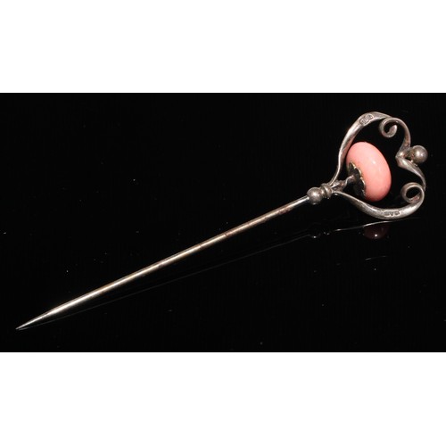 121 - A 19th century diamond and coral stick pin, central coral cabochon quartered by round old cut diamon... 