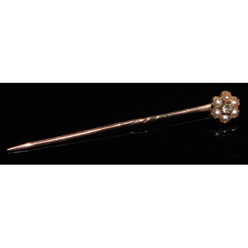 124 - A 19th century diamond floral cluster stick pin, set with nine old cut diamond accents, unmarked yel... 