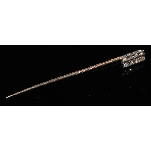 124 - A 19th century diamond floral cluster stick pin, set with nine old cut diamond accents, unmarked yel... 