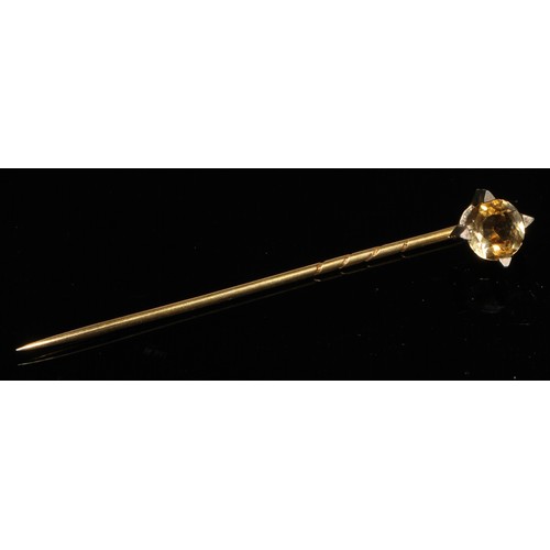 124 - A 19th century diamond floral cluster stick pin, set with nine old cut diamond accents, unmarked yel... 