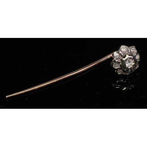 124 - A 19th century diamond floral cluster stick pin, set with nine old cut diamond accents, unmarked yel... 