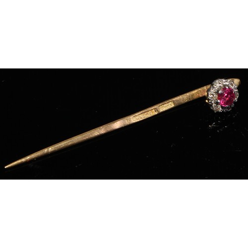 124 - A 19th century diamond floral cluster stick pin, set with nine old cut diamond accents, unmarked yel... 