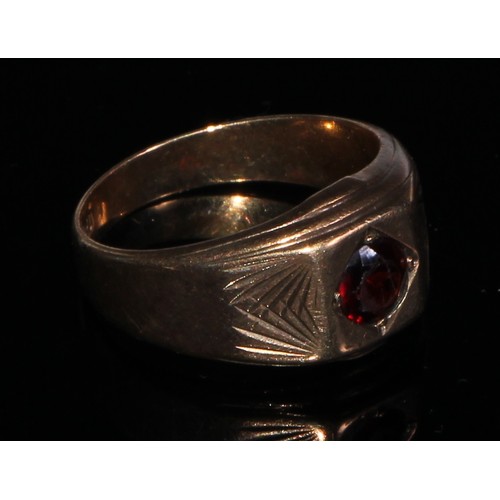 142 - A 9ct gold carnelian signet ring, plain oval matrix, stamped 9ct gold, 4.5g gross;  another garnet s... 