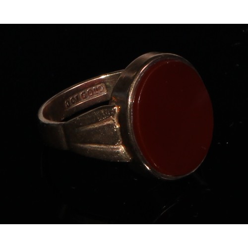 142 - A 9ct gold carnelian signet ring, plain oval matrix, stamped 9ct gold, 4.5g gross;  another garnet s... 