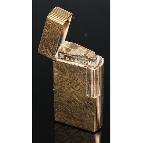 293 - A Dunhill 70 cigarette lighter, FY835, textured gold coloured body, flick lid, roll striker, boxed w... 