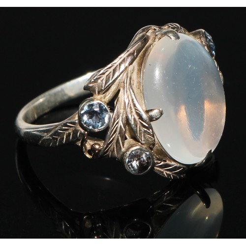 160 - A diamond and moonstone heart cluster ring, cental moonstone heart cabochon, surrounded by eighteen ... 