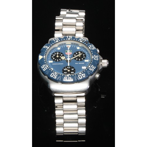 98 - Tag Heuer - a 1/10 chronograph quartz wristwatch,  blue dial,  luminous dot and block batons, three ... 