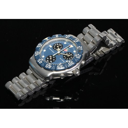 98 - Tag Heuer - a 1/10 chronograph quartz wristwatch,  blue dial,  luminous dot and block batons, three ... 