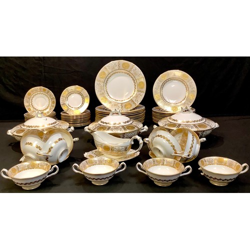 858 - A T Goode & Co dinner service, for twelve, banded in gilt with panels of chrysanthemums, printed mar... 