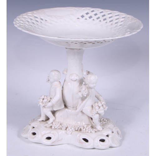 720 - A Samson Hancock Derby figural candlestick, Allegorical of Winter, in the white, 32cm high, S H crow... 