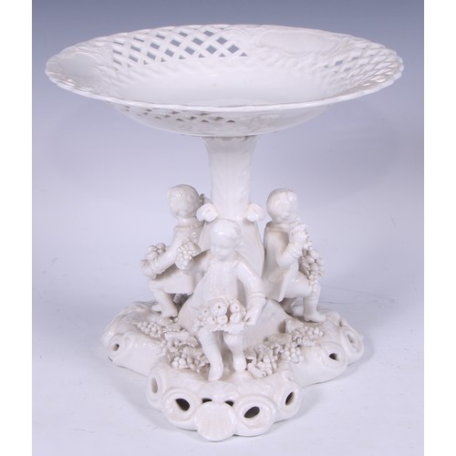 720 - A Samson Hancock Derby figural candlestick, Allegorical of Winter, in the white, 32cm high, S H crow... 