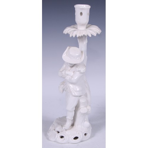 720 - A Samson Hancock Derby figural candlestick, Allegorical of Winter, in the white, 32cm high, S H crow... 