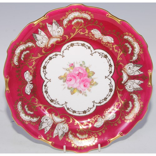 746 - A Royal Crown  Derby shaped circular plate, the field with three roses, within a shaped reserve, rub... 