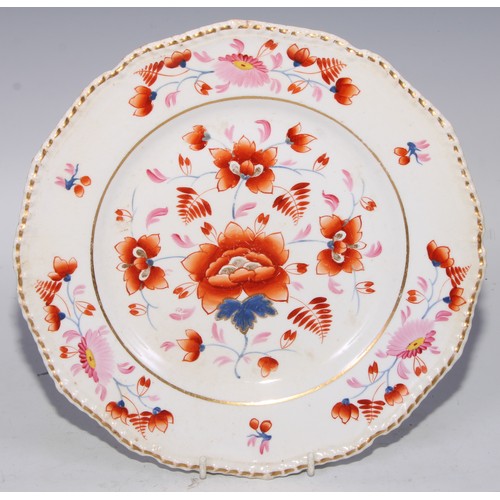 746 - A Royal Crown  Derby shaped circular plate, the field with three roses, within a shaped reserve, rub... 