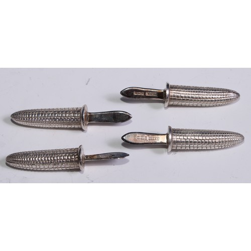 298 - A set of four silver sweetcorn holders, the hafts as corn, 6.5cm long, cased, Birmingham 1960