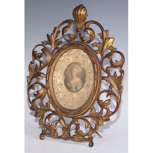 360 - A William Tonks and Sons brass rectangular mirror, cast with radiating mask, cherubs and pierced wit... 