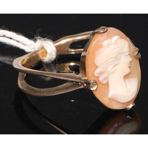 143 - A 9ct gold carved opal and quartz cameo ring, size O, marked 375, 5g; a 9ct gold carved shell cameo ... 